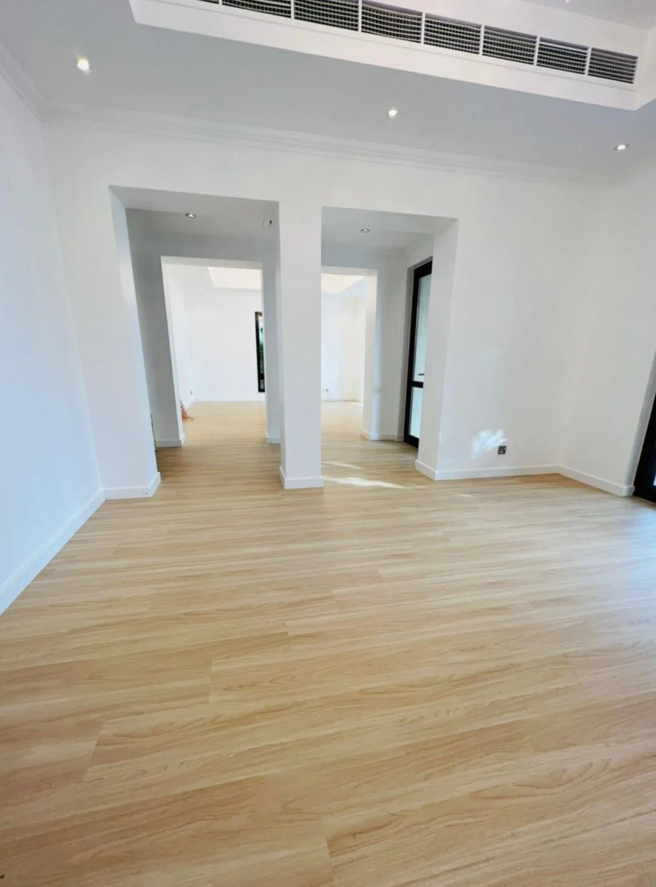 Natural oak HSPC in an open-plan villa hall